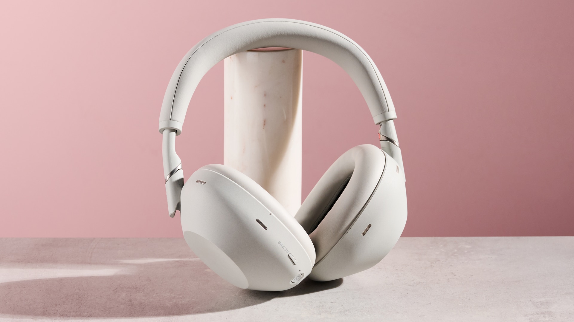Sony WH-1000XM6 leaning on pole